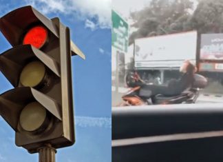 Pemuda baring atas motosikal kerana tunggu lampu isyarat terlalu lama