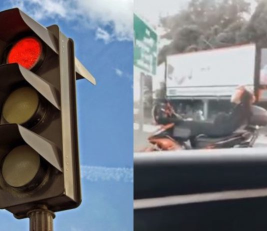 Pemuda baring atas motosikal kerana tunggu lampu isyarat terlalu lama