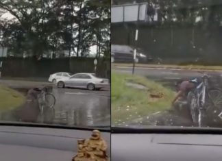 Lelaki baik hati ini buang sampah tersumbat elak air bertakung di jalan raya