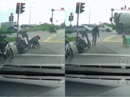 Penunggang motosikal baik hati tolong kutip paku bertaburan di jalan raya