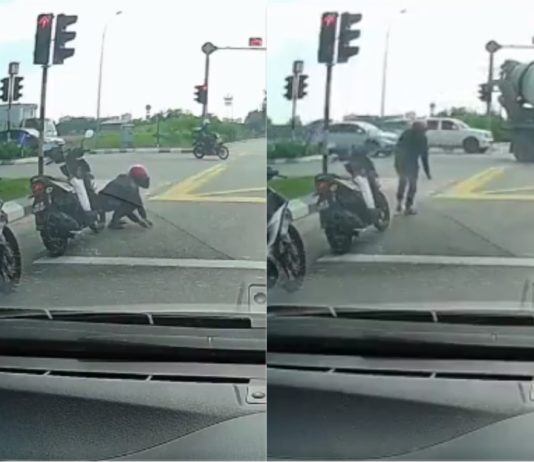Penunggang motosikal baik hati tolong kutip paku bertaburan di jalan raya