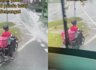 Rider Food Panda santai walaupun terkena percikan air hujan kenderaan