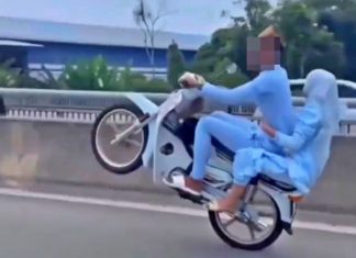 Remaja pasangan suami isteri buat aksi wheelie serah diri