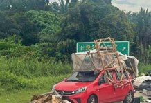 Polis tahan Perodua Axia angkut barang macam lori