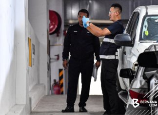 Polis tembak mati dua penjenayah di parkir kereta kondominium