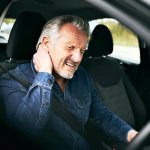GEM driver with neck pain (Shutterstock)