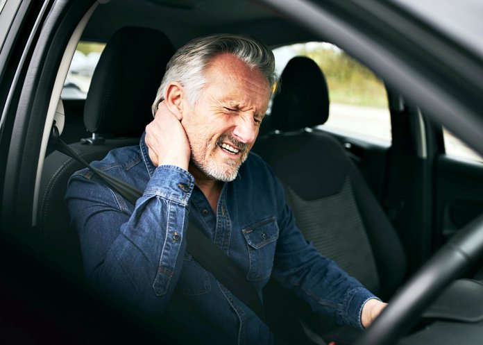 GEM driver with neck pain (Shutterstock)